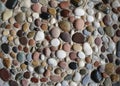 Sea pebbles in the sand. Royalty Free Stock Photo