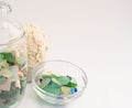 Sea pebbles and shells in glass containers Royalty Free Stock Photo