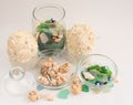 Sea pebbles and shells in glass containers Royalty Free Stock Photo