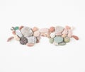 Sea pebbles, sea stones sunglasses. Sea pebbles background Royalty Free Stock Photo