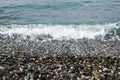 Sea pebbles and waves Royalty Free Stock Photo