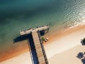 Old wooden jetty at a sea with blue sky a background. Royalty Free Stock Photo