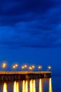 Sea pier at the Baltic Sea shoreline in Gdynia Orlowo, Poland at evening twilight Royalty Free Stock Photo