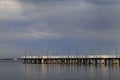 Sea pier at the Baltic Sea shoreline in Gdynia Orlowo, Poland at evening twilight Royalty Free Stock Photo