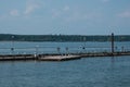 Sea pier with seagulls, blue sea and sky