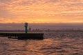 Sea pier and Tallinn cityscape on sunset Royalty Free Stock Photo