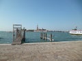 Sea pier in Venice opposite the island of San Michele. Venice, Italy. August 2012