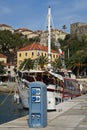 Sea pier with the walking yacht Royalty Free Stock Photo