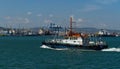 Sea Pilot `Adis` is sailing in turquoise water along Tsemes bay. Close-up of white work boat `Adis` on Novorossiysk