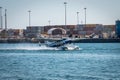 Sea Plane lands near cargo containers in Miami Florida USA