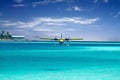 Sea plane taking off in ocean Royalty Free Stock Photo