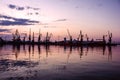 Sea port cranes, sunset, Odessa, Ukraine Royalty Free Stock Photo