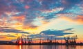 Sea port and industrial cranes, Varna, Bulgaria.Sunset over the Varna lake Royalty Free Stock Photo