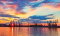 Sea port and industrial cranes, Varna, Bulgaria.Sunset over the Varna lake Royalty Free Stock Photo