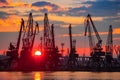 Sea port and industrial cranes, Varna, Bulgaria.Sunset over the Varna lake Royalty Free Stock Photo