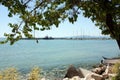 Sea port marina with moored white yachts, horizontal landscape with sea, ships, mountains and blue sky, horizon bright sunny