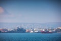 Sea port Varna, Bulgaria and beautiful morning landscape. Cargo ships, industrial cranes and navigation tower Royalty Free Stock Photo