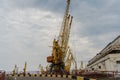 Sea port with yellow working cranes in Ukraine