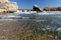 Sea remote bay with rocks and stones. Sea surf on the beach in an abandoned bay Royalty Free Stock Photo