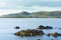 Sea, rocks and village of Budoni coastline, Sardinia, Italy