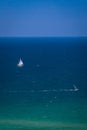 Sea with sailing ships and windsurfers Royalty Free Stock Photo