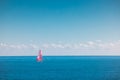 Sea and sailing wind boat. Sailboat over blue waves and sunny sky