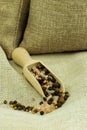 Sea salt and allspice on a wooden spoon Royalty Free Stock Photo