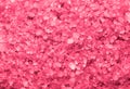 Sea salt background or texture in pink color. Little minerals Royalty Free Stock Photo