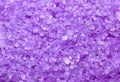 Sea salt background or texture in violet color. Little minerals Royalty Free Stock Photo