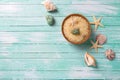 Sea salt in bowl with sea objects on turquoise wooden backgroun Royalty Free Stock Photo