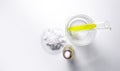 Sea Salt in Chemical Watch Glass and Nickle chloride liquid in test tube place next to Dropper Bottle with Yellow cosmetic liquid Royalty Free Stock Photo