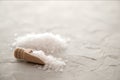 Sea salt crystals in wooden scoop close-up on concrete background. Small shovel with sea salt. Copy space Royalty Free Stock Photo