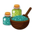 Sea salt in glass jars and wooden scoop. Crystals in transparent bottles and ladle