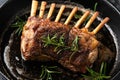 Sea salt and rosemary rack of lamb roasted on cast iron pan