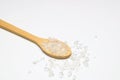 sea salt in a spoon isolated on white background Royalty Free Stock Photo