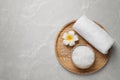 Sea salt, towel and flower on grey marble table, top view with space for text Royalty Free Stock Photo
