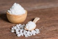 Sea salt in wood spoon and bowl. Royalty Free Stock Photo