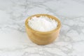 Sea salt in wooden bowl on Tiles Royalty Free Stock Photo