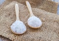 Sea salt in wooden spoon on burlap sack Royalty Free Stock Photo