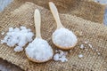 Sea salt in wooden spoon on burlap sack Royalty Free Stock Photo