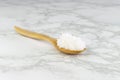 Sea salt in wooden spoon on Tiles Royalty Free Stock Photo