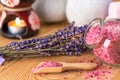 sea salt in a wooden spoon with natural lavender oil and a bunch of dried flowers spa Royalty Free Stock Photo