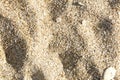 Sea sand background texture, top view, shadow on the sand stone in the sand Royalty Free Stock Photo