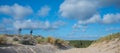 Sea, Sand and Dunes-People playing and walking on the beach Royalty Free Stock Photo