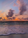 Colorful ocean beach sunset, soft waves. Inspirational sea view and horizon under colorful sky and clouds Royalty Free Stock Photo