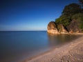 The sea,the sand,the sky and the rocks on a clear day Royalty Free Stock Photo