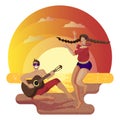 Sea and sandy beach on sunset. Young guy guitar player playing guitar for a dancing girl Royalty Free Stock Photo
