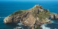 Sea scape on background gaztelugatxe steps sun huan, hipster girl looking on nature horizon ocean, relax holiday, blank space blue Royalty Free Stock Photo