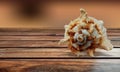 Sea Shell on brown Wood table Background. Royalty Free Stock Photo