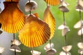 Sea shell hanging on bokeh background. The hanging curtains made of shells are crafts produced by skilled workers Royalty Free Stock Photo